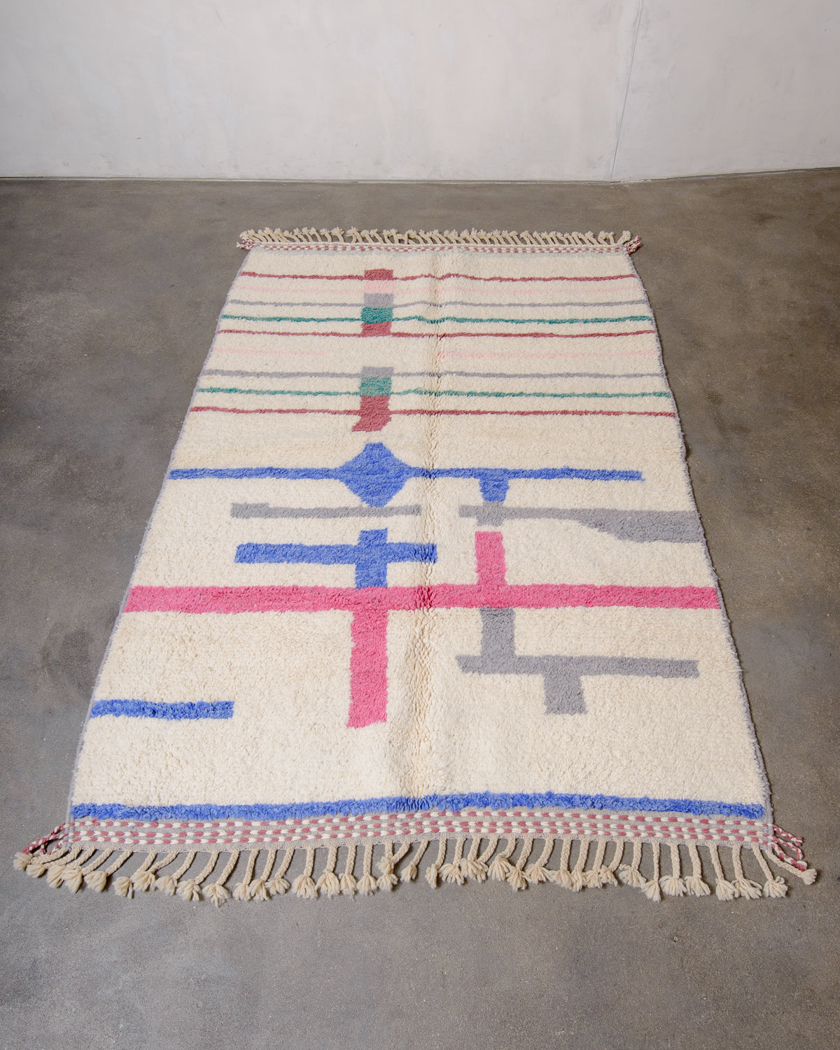 Modern, designer, handcrafted Berber rug from Morocco. Beniourain carpet with beautiful colours and patterns and fluffy wool texture.